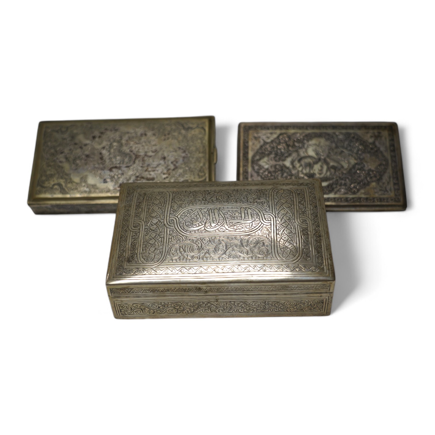 An Egyptian white metal cigarette box, 14,5cm, a Persian white metal cigarette box and similar cigarette case, gross weight 26.6oz. Condition - poor to fair